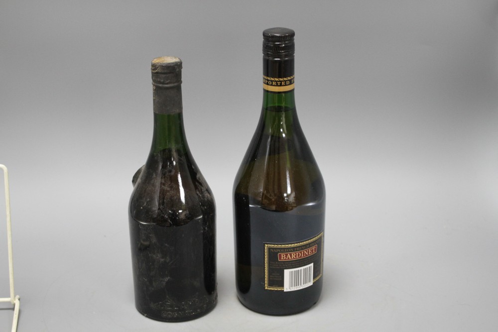 A bottle of Delamaine & Co Cognac Pale and Dry and a bottle of Napoleon Bardinet French Brandy